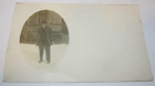 Vintage Postcard Showing A Man In Snow Gentleman in Front of Old Building — photo 1