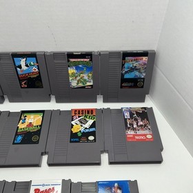 Lotto 11 fantastici giochi NES - solo carrello - testati/funzionanti Mario TMNT Top Gun Sports