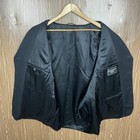 Black solid three-button blazer jacket with notch lapels, front flap pockets, and subtle textured fabric on hanger.