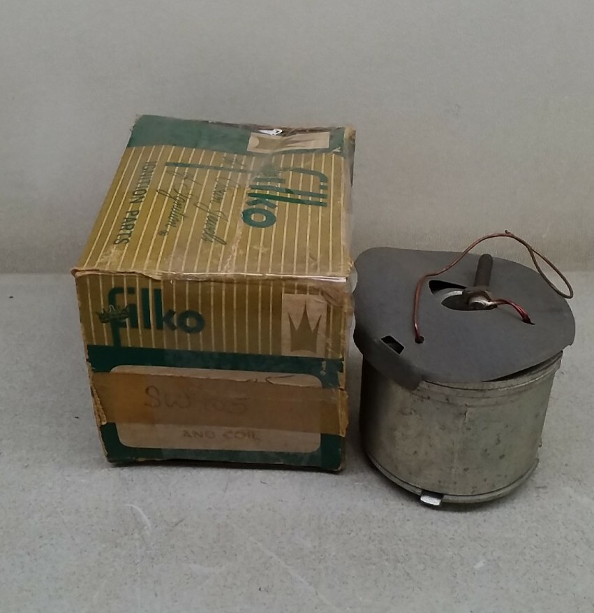 Gray metal SW105 Filko ignition coil with red and green printed box labeled “SW105 Filko and Coil.”