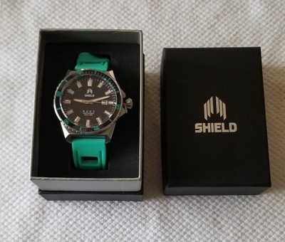 NIB Shield Silver Tone Date Watch Black Dial Turquoise Silicone 7''-9'' Running