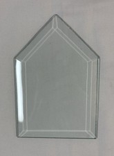 Beveled glass piece. 4X6 Clear Glass With 1/2 Bevel. It Is House Shaped.
