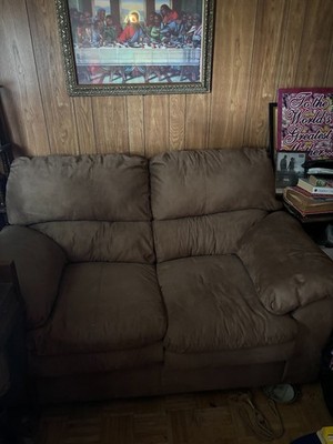 This is a used brown sofa in excellent condition. Length 65 in and Width 36 in
