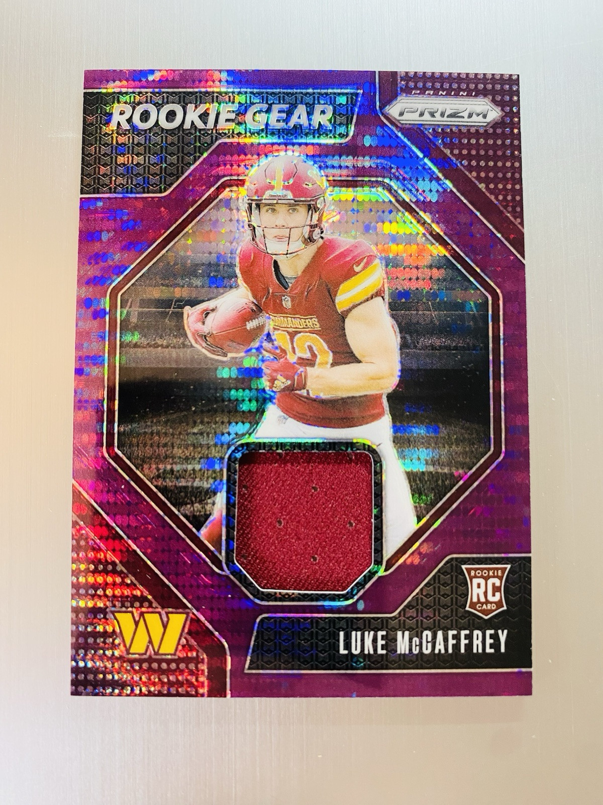 Luke McCaffrey 2024 Panini Prizm Rookie Gear #RG-LMY Purple Pulsar Commanders Rc