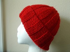 Hand knitted cozy and warm hat, bright red
