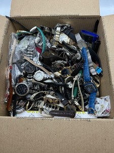 16 pound bulk box of watches for parts and repair.
