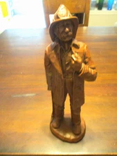 Red Mill Mfg. Fireman with helmet holding axe carved wood sculpture statue 11''
