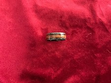Silver colored band ring with wooden accent stripe