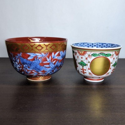 Made by Akiami Takano, red ground, gold dyed, pine, bamboo, plum and crane
