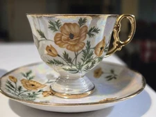Vintage Ucagco "August Poppy" lusterware teacup saucer set.