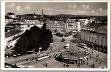 Graz Austria Jakominiplatz Trams And Buildings Vintage RPPC Postcard