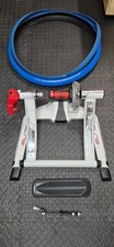 Elite Qubo Fluid bike turbo trainer, front wheel riser, thru-axle adapter, tyres