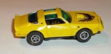 Autoworld Xtraction Slot Car '77 Pontiac Firebird Yellow W/Green Windshield Runs