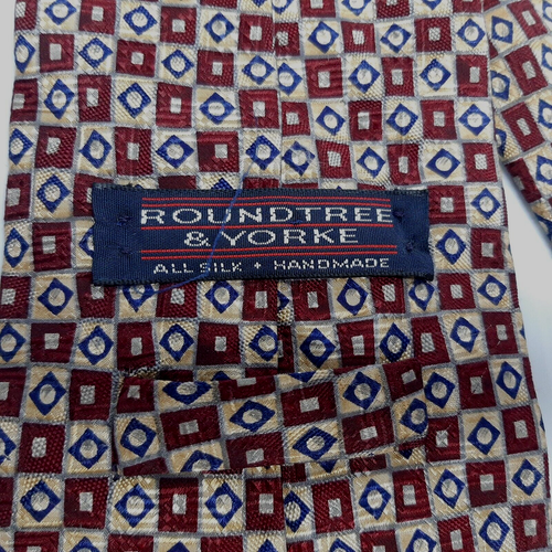 Cravatta Rountree & Yorke 100% seta marrone oro blu motivo geometrico - Foto 8 di 10