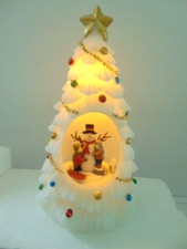 illuminated white Christmas tree with snowman inside 3 AA batteries required 