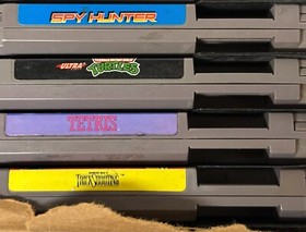 ORIGINAL  NINTENDO NES SYSTEM WITH 21 GAMES AND 2 GAME GENIE BUNDLE.