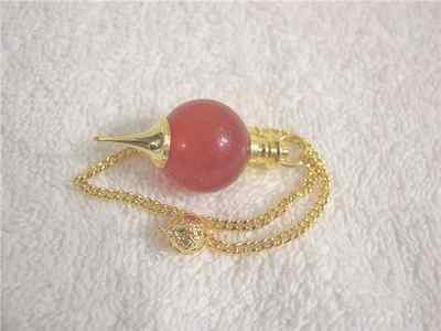 Pendulum all natural carnelian with brass point,chain and holding bead 9 inch