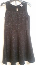 Girls party dress with belt. Black. Multicolored glitter. Sheer upper bodice.