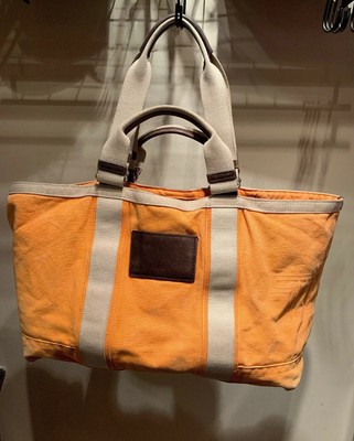tumi orange bag
