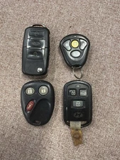 Lot of 4 Various Key Fobs for Parts Or Repair. Untested. See Description