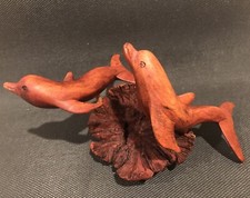 Hand Carved Wooden Dolphins On Driftwood Stand