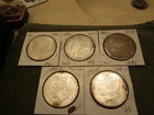 (5) MORGAN SILVER DOLLARS  UNSLABBED COINS BUT THEY LOOK UNC