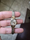 Timex women's gold dress watch. Small iridescent face. Working watch Vintage