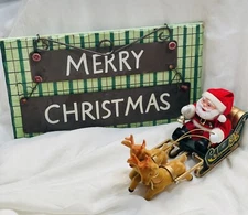 Merry Christmas Sign with Santa, Sleigh, and Reindeer