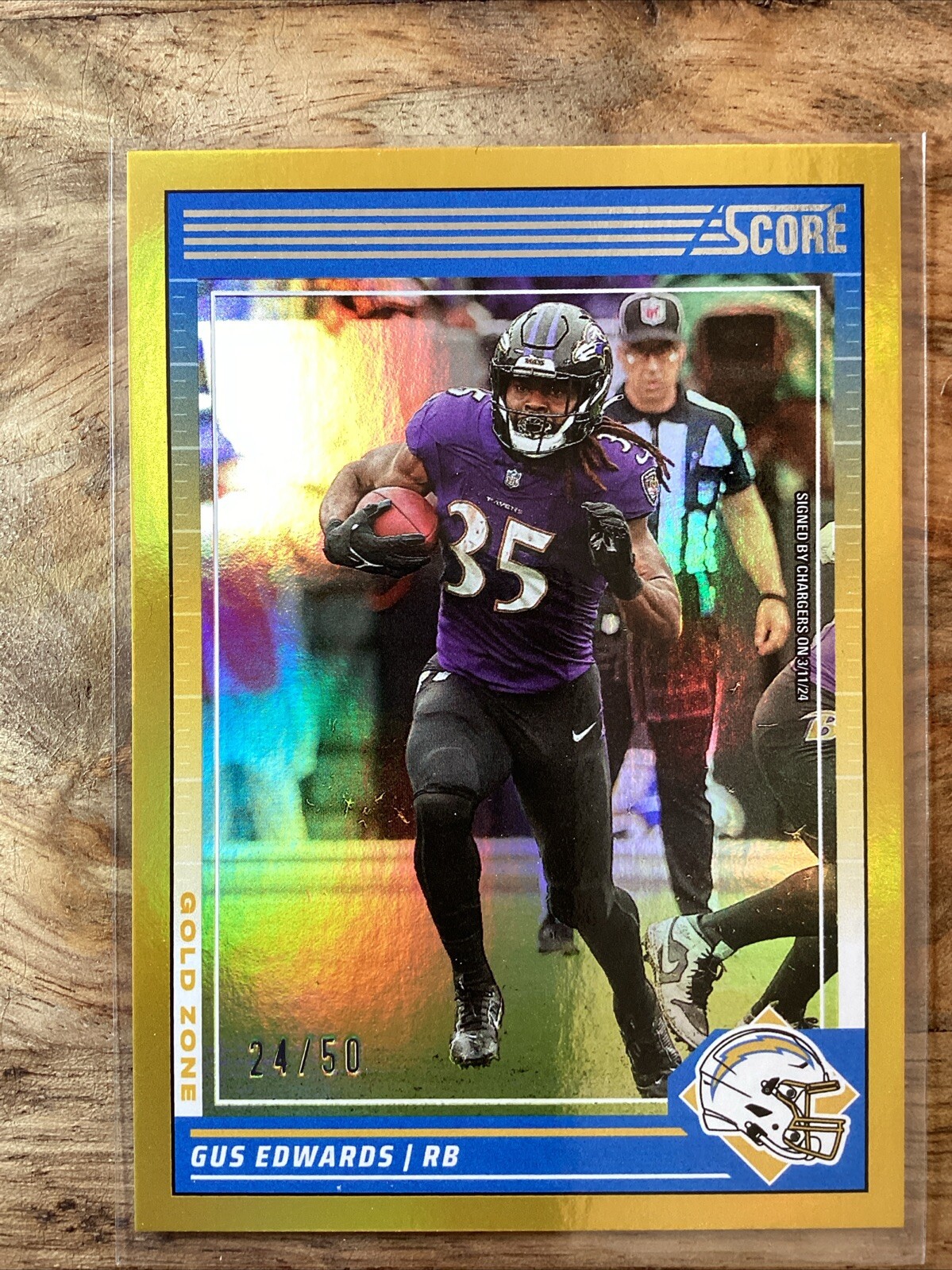 Gus Edwards # 24/50 2024 PANINI SCORE GOLD ZONE FOIL PARALLEL CHARGERS Ravens