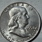 1958d Franklin silver half dollar.Unc