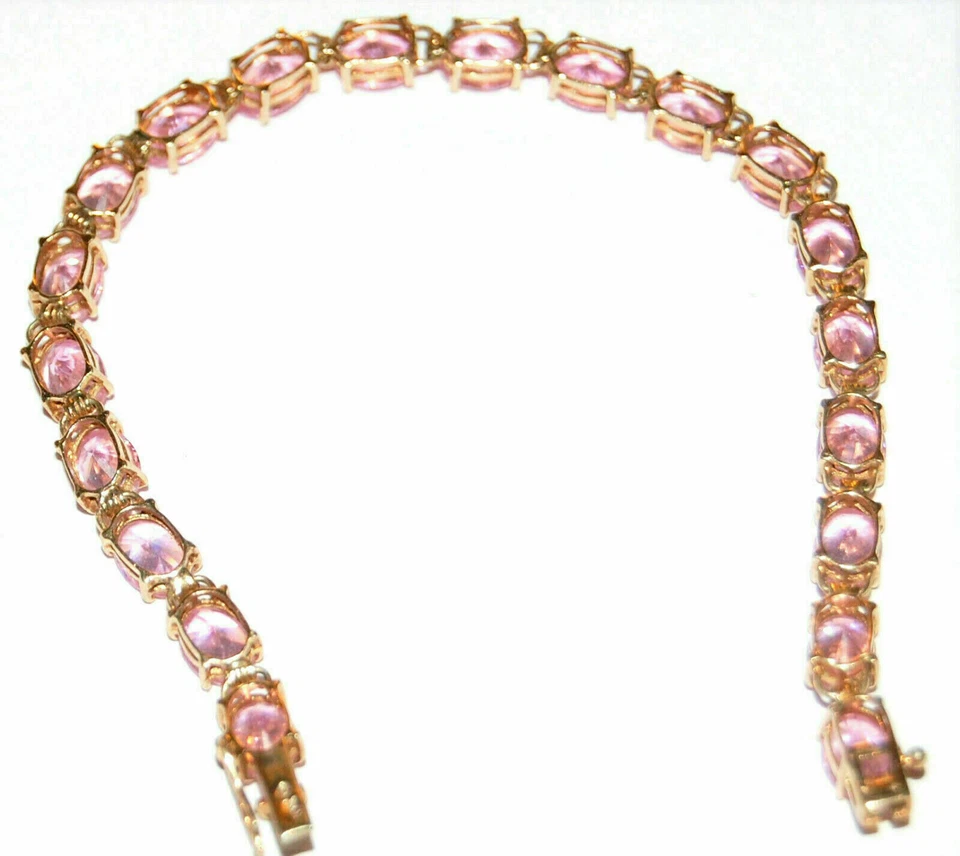 Brazalete de tenis para mujer de zafiro rosa creado en laboratorio ovalado de 9 quilates acabado en oro amarillo de 14 quilates Foto 3 de 4