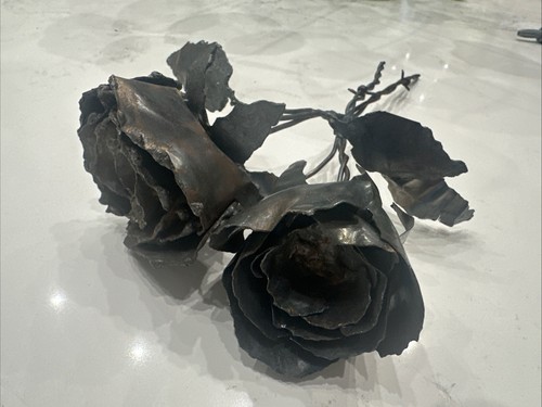 Two hand-forged iron roses with Barb Wire Stems sculptures