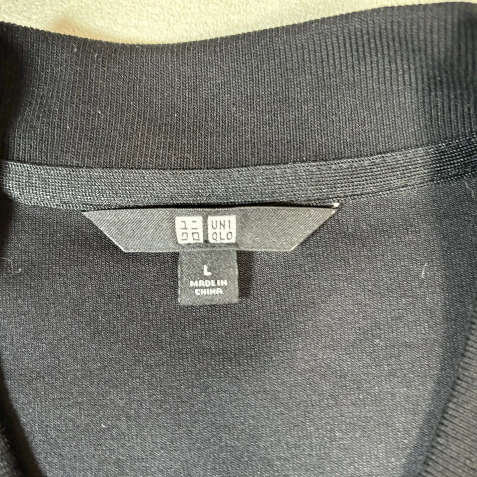 Chaqueta grande Uniqlo silla de ruedas tenis gira Roger Federer ITF Novac Djokovic Foto 2 de 4
