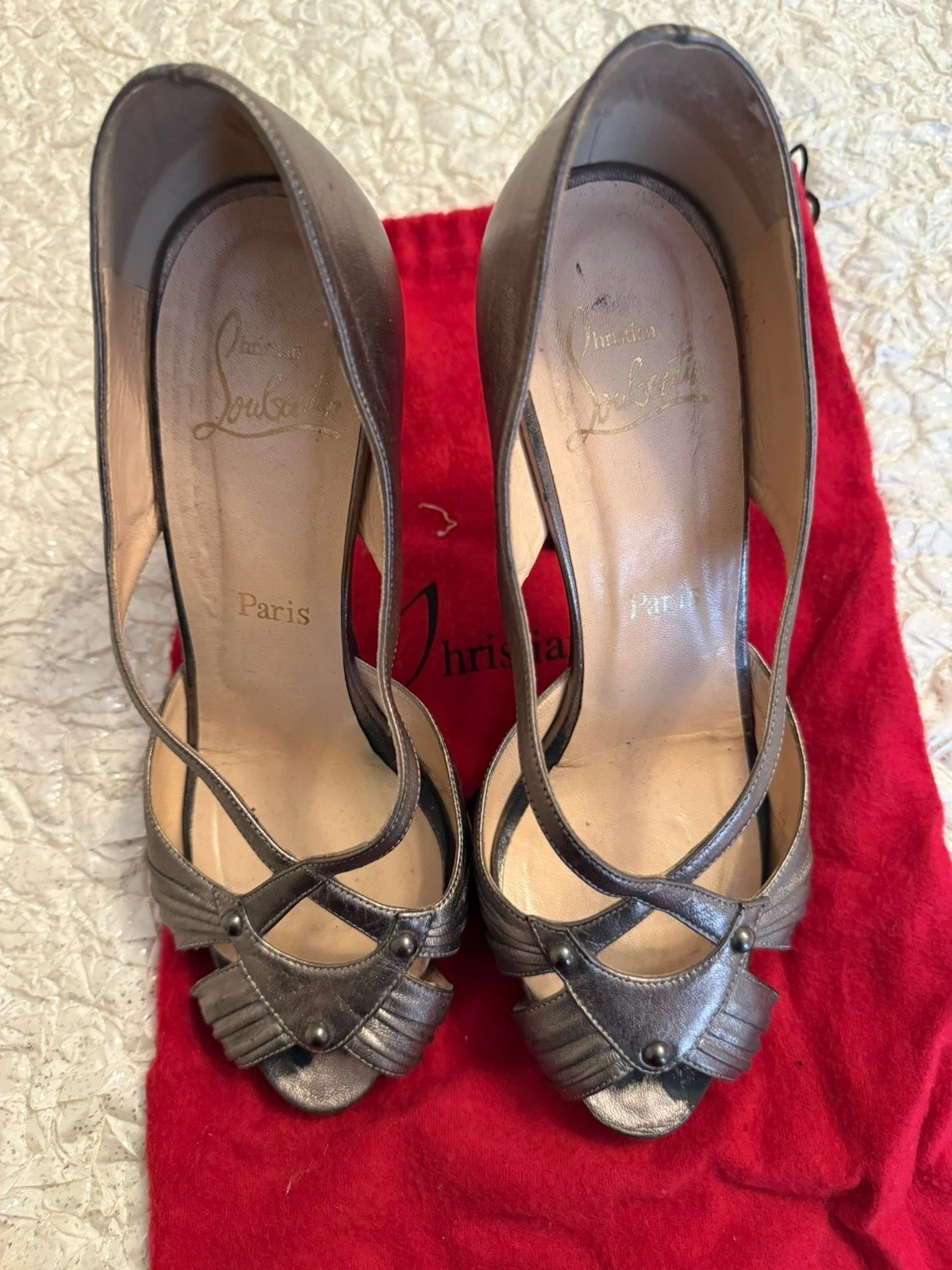 Christian Louboutin — Christian Louboutin Pewter Criss Cross Heel