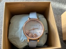 Ladies Olivia Burton watch new with box needs battery floating daisy design