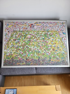 Heye Mordillo Puzzle - Crazy World Cup (4.000 Teile) in gerahmter Form