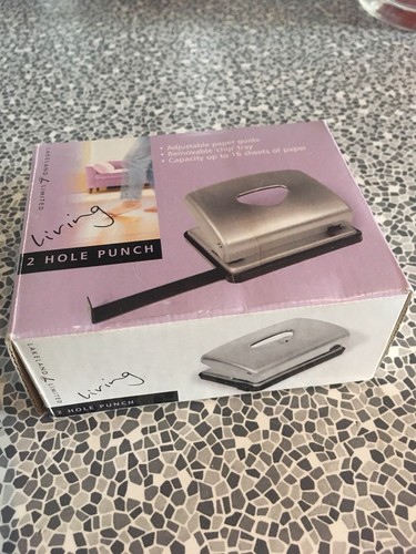 2 hole punch. new in box. lakeland. adjustable paper guide.