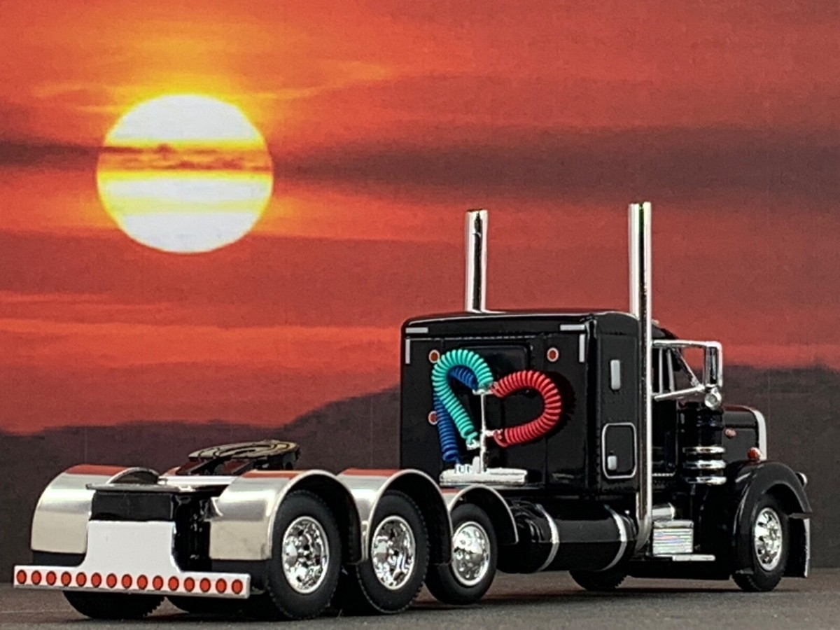 1/64 DCP BLACK PETERBILT 379 TRI AXLE W/ 36