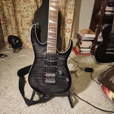 Ibanez RG4EXFM1 electric guitar in a Transparent Gray Burst finish.