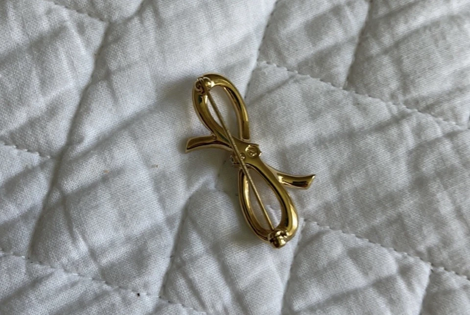 Broche prendedor de cristal con lazo dorado Swarovski Foto 3 de 4