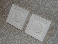 A pair of traditional flower design door / window frame architrave corner blocks