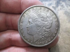 1878 78 REVERSE US MORGAN SILVER DOLLAR IN ABOUT UNCIRCULATED CONDITION