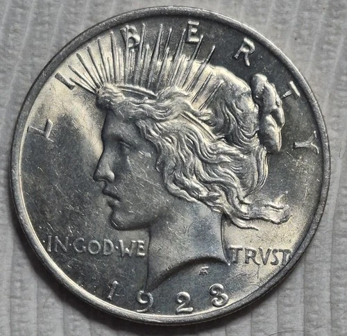 1923 P Peace Silver Dollar. Estimated Almost Uncirculated 58. Die Crack. A0881