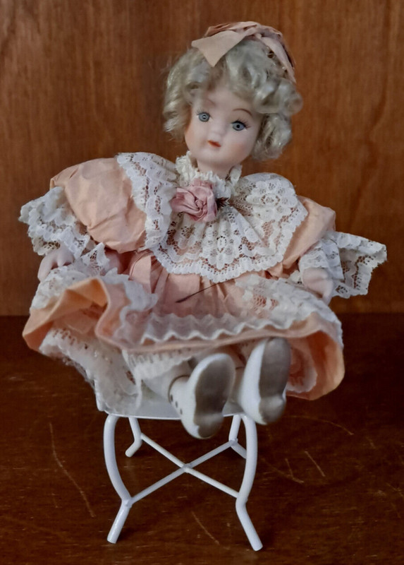 Porcelain Doll Dressed in Peach Dress