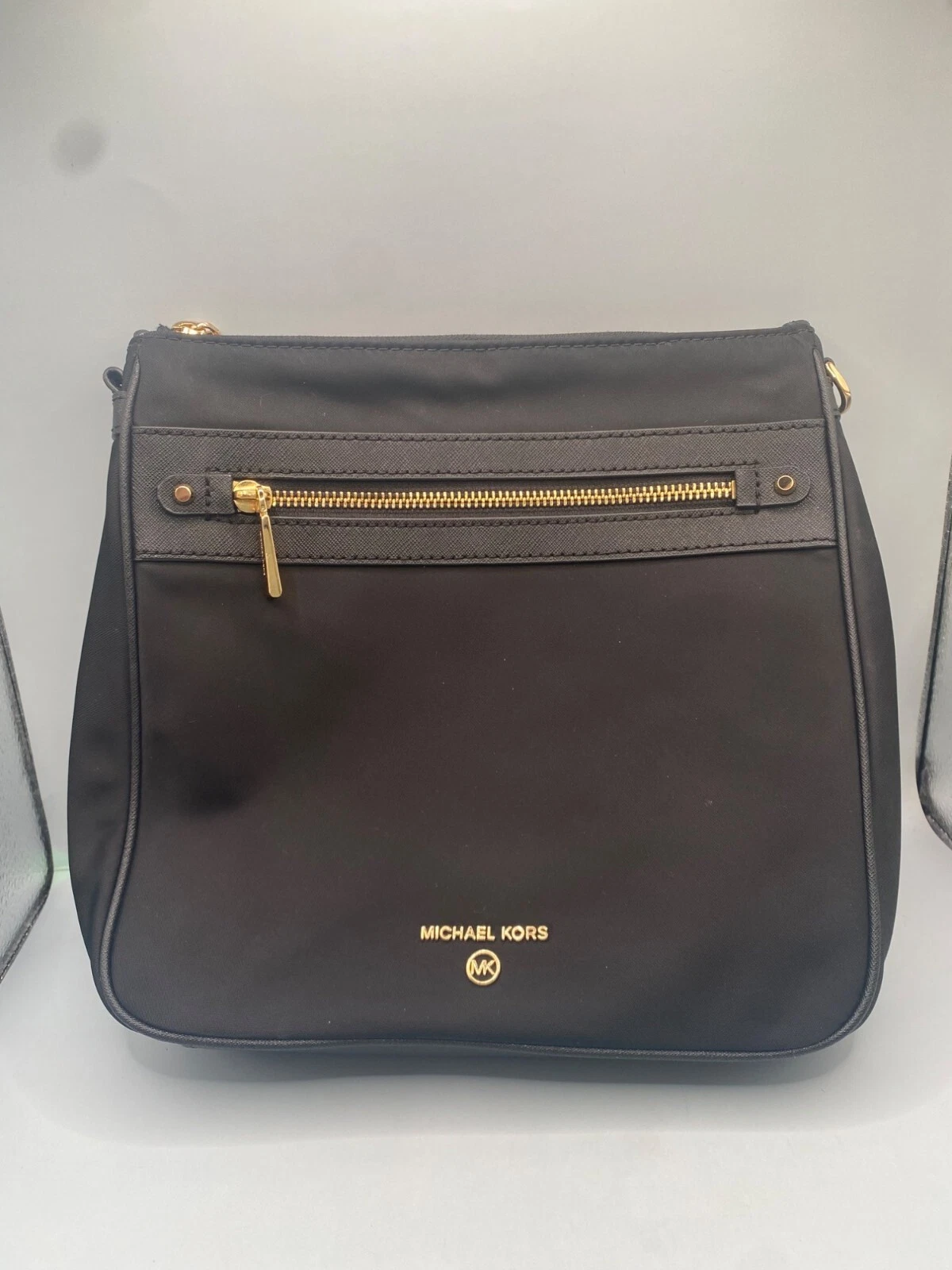 Borsa donna Michael Kors in pelle con tasche e cerniera difettosa (mancano cinghie)