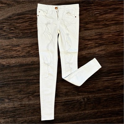 Almost Famous Women s White Skinny Jeans with Holes Size (0) NWOT