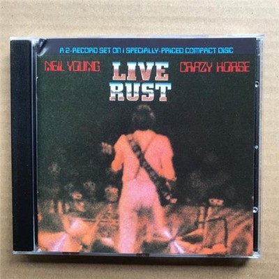 NEIL YOUNG LIVE RUST CD RE-ISSUE OF 1979 LIVE ALBUM (SMALL CORNER CREASE ON INSE