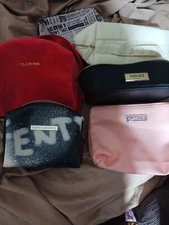 Name Brand Cosmetic Bags. Variety of eight different sizes and different brands.