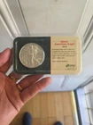New Listing2004 SILVER AMERICAN EAGLE  1 OZ  FINE SILVER LITTLETON HOLDER. Uncirculated