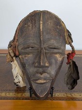 Dan gle ceremonial mask with feathers and woven fibre trim, wood-carved, African